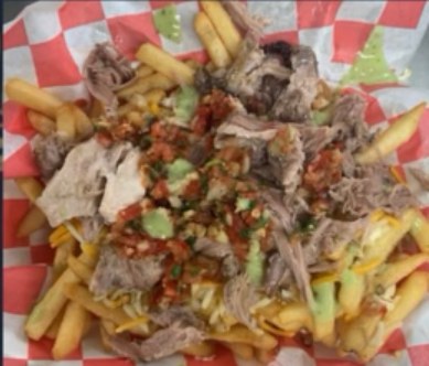 Loaded fries topped with meat, cheese, pico, and house sauce